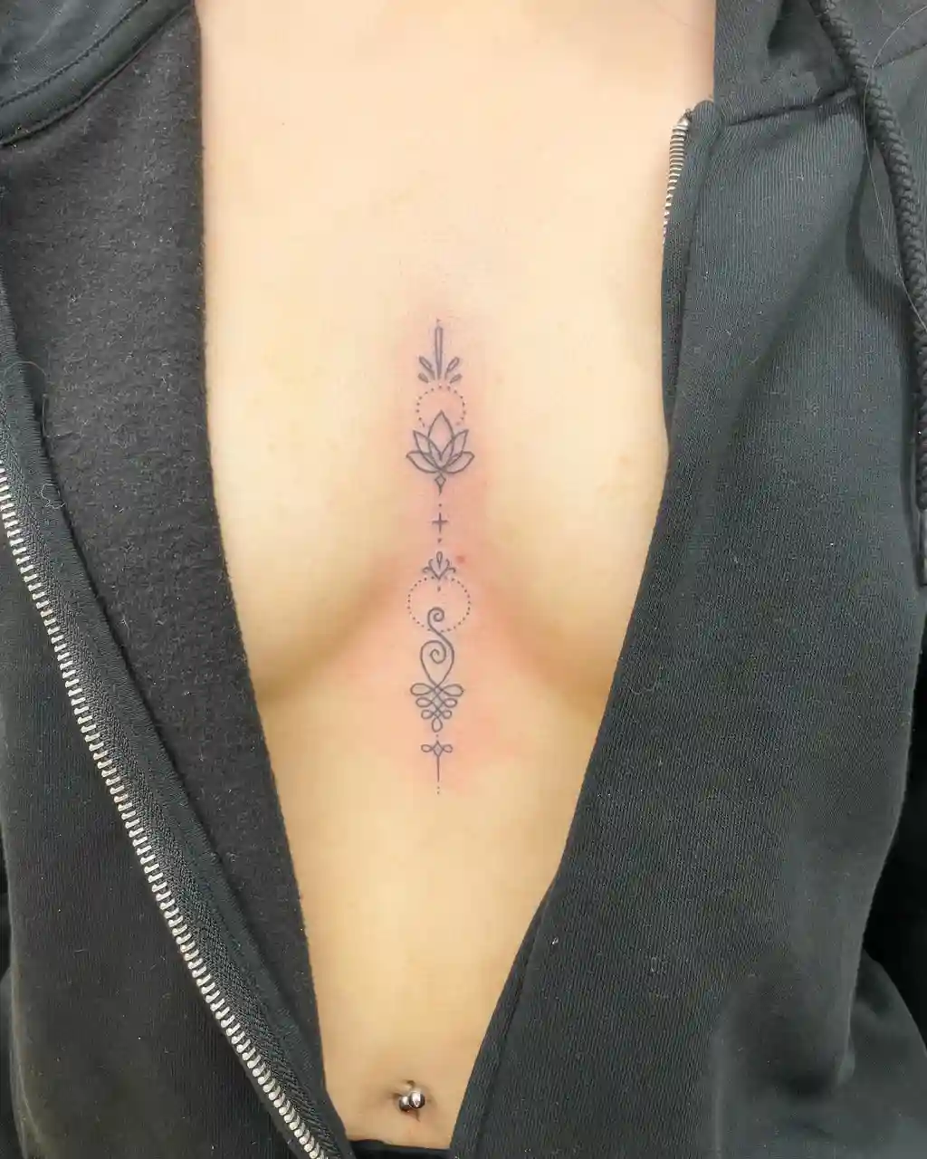 Mandala Symbol Tattoo on Sternum