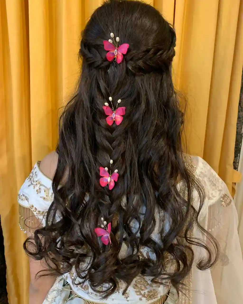 Butterfly-Embellished Half-Up Curls