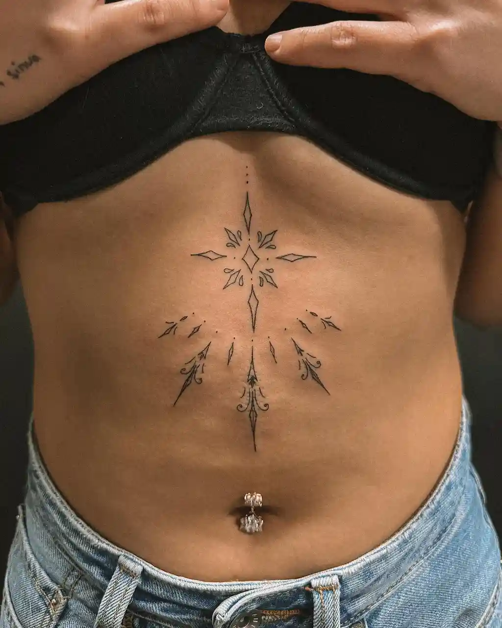 Radiant Geometric Tattoo on Stomach
