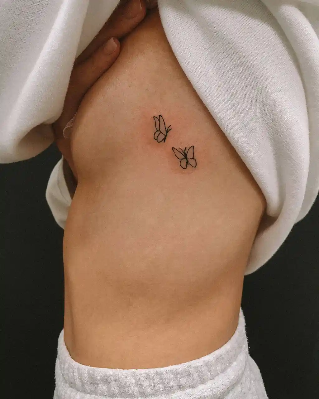 Butterfly Linework Tattoo on Side Rib