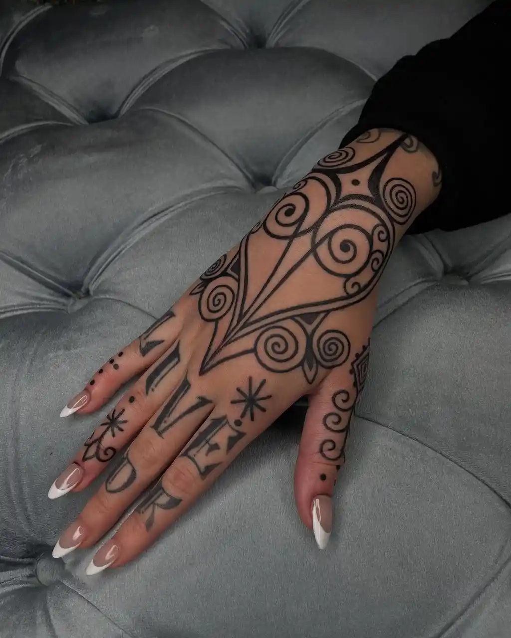 Bold Tribal Hand Tattoos for Women
