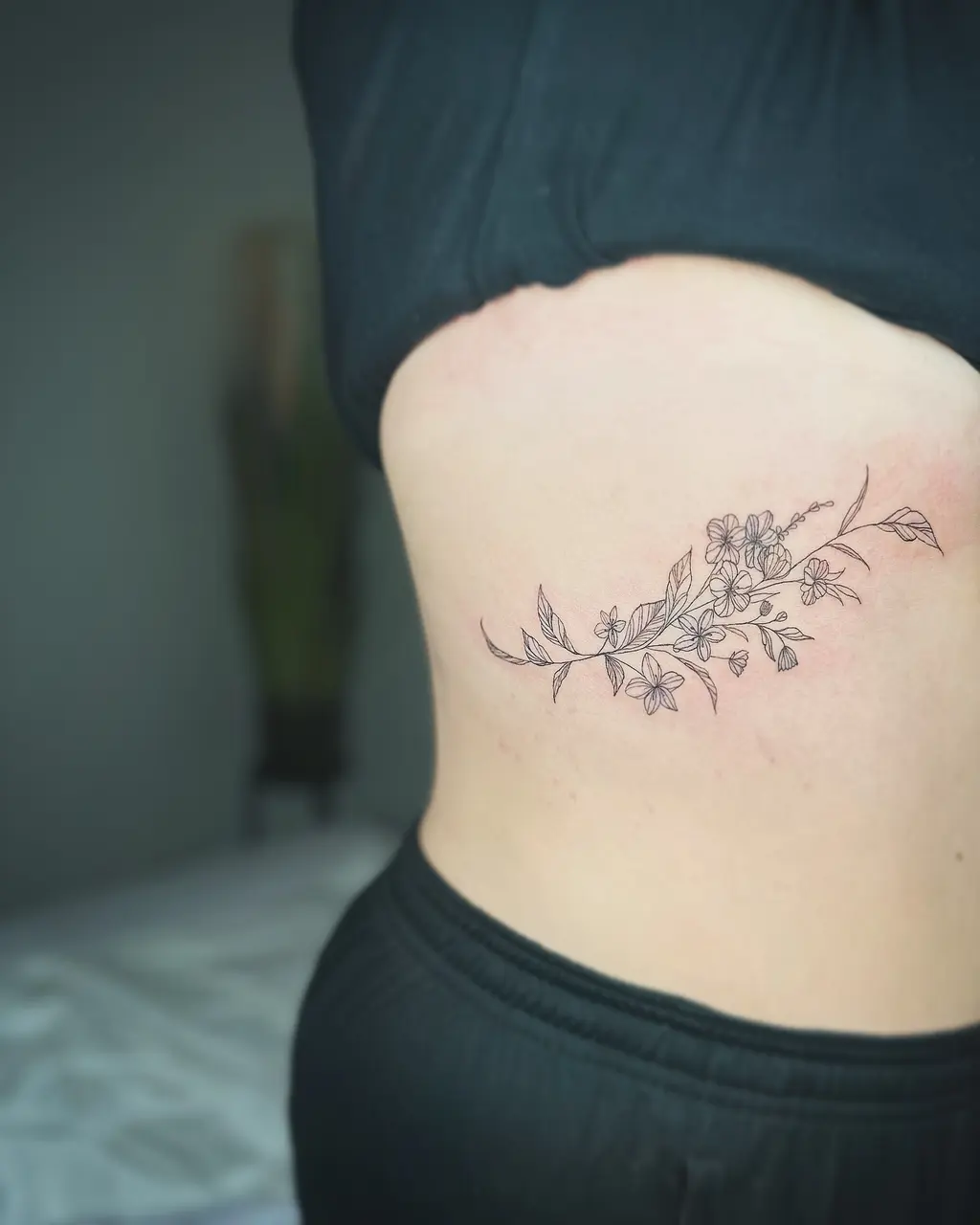 Blooming Branch Rib Tattoos for Women