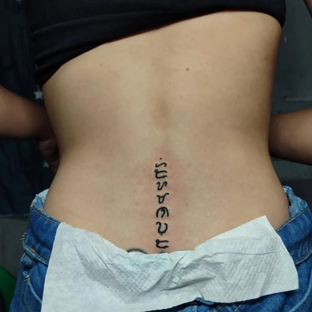 Scripted Vertical Lower Back Tattoo for Women