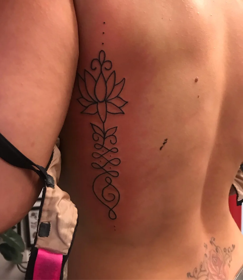 Lotus Spiritual Flow Rib Tattoos for Women