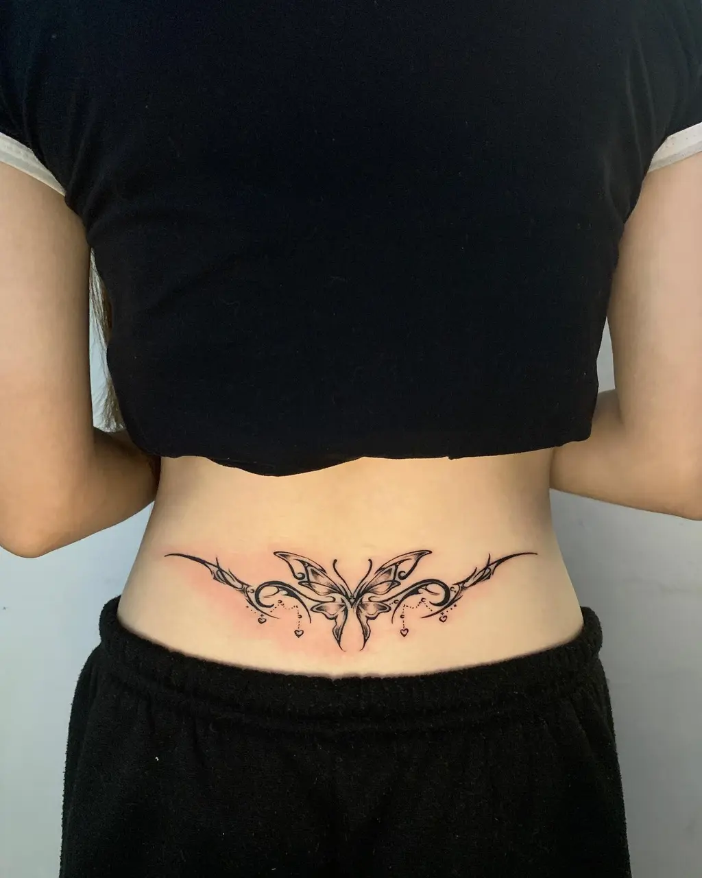 Lower Back Butterfly Tribal Tattoo Design