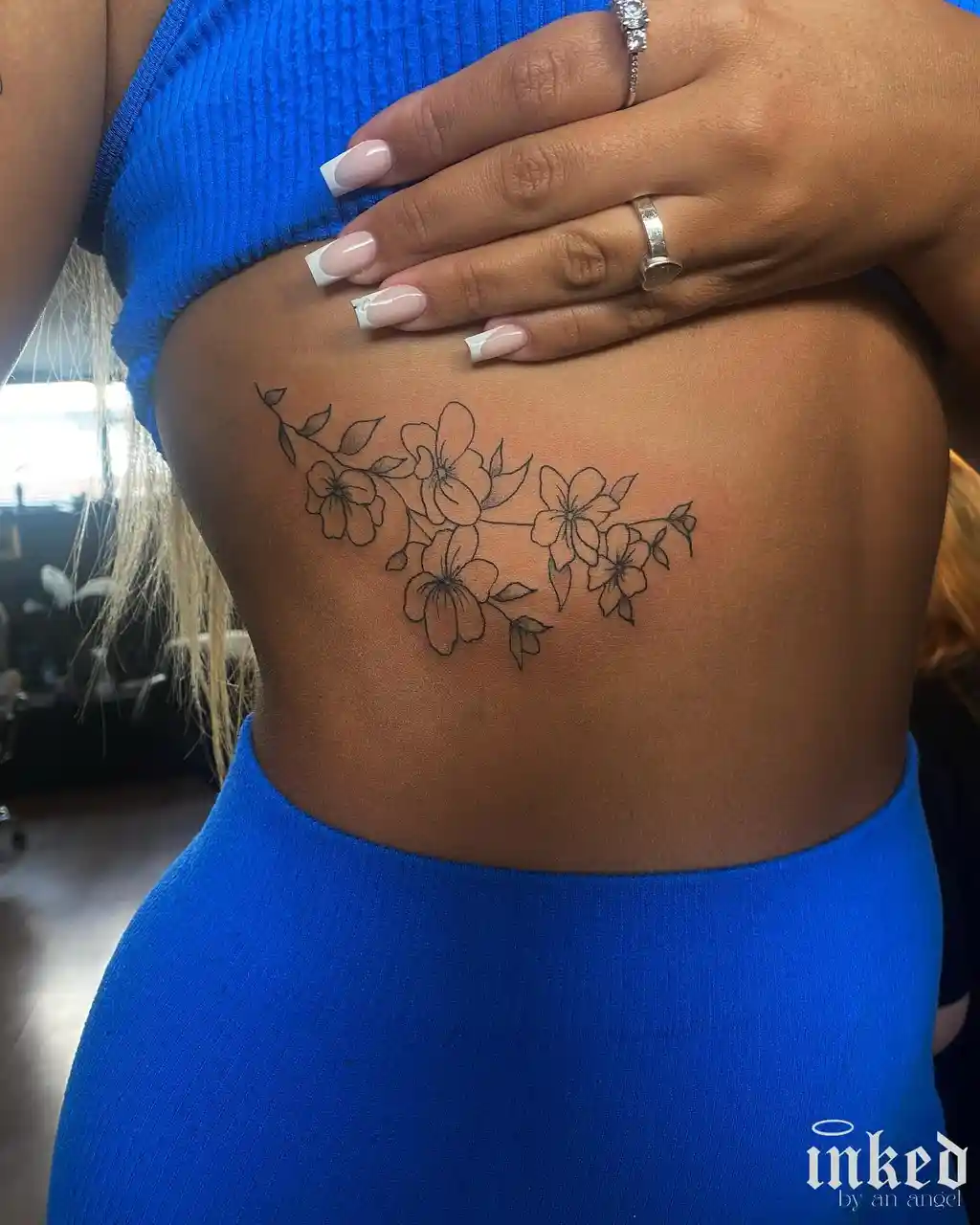 Soft Floral Curve Rib Tattoos for Women