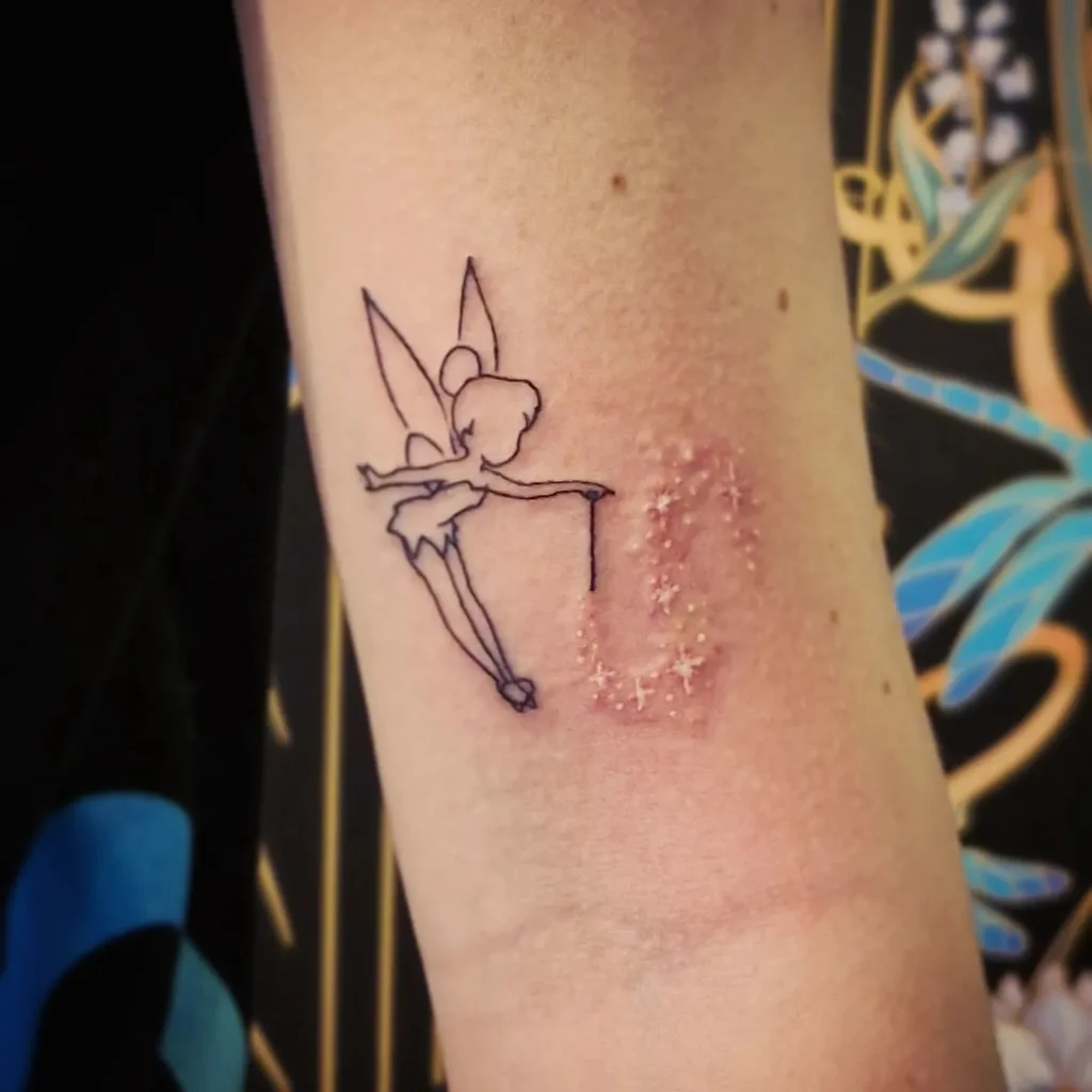 Fairy Dust Upper Arm Tattoos for Women