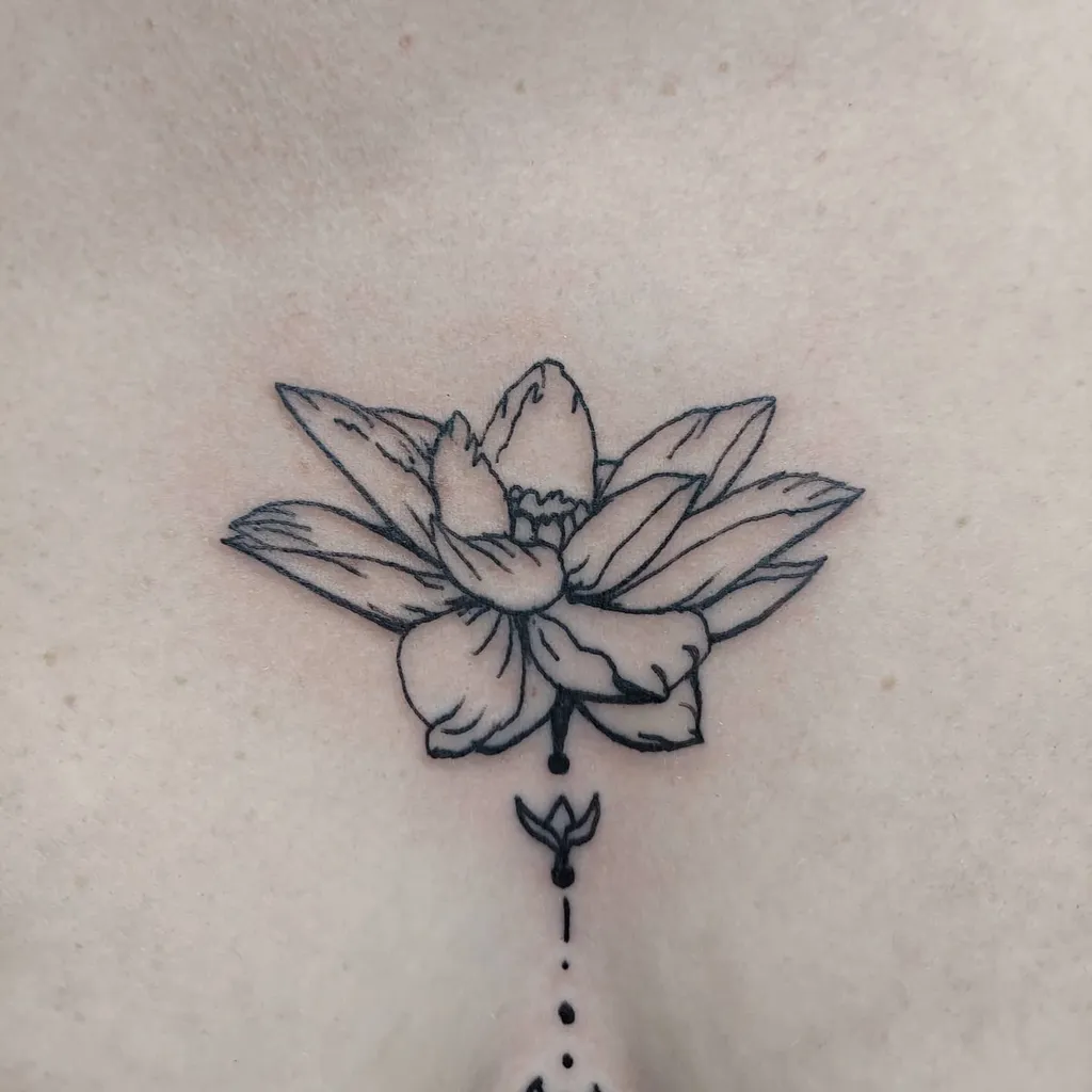 Chest Tattoo Female with Bold Lotus Line Art