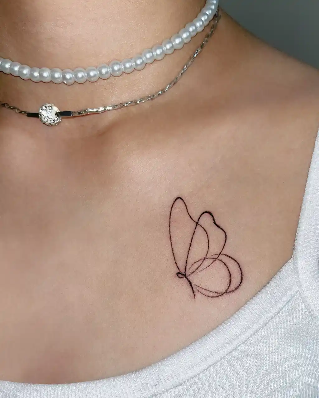 Outline Butterfly Collarbone Tattoos for Women