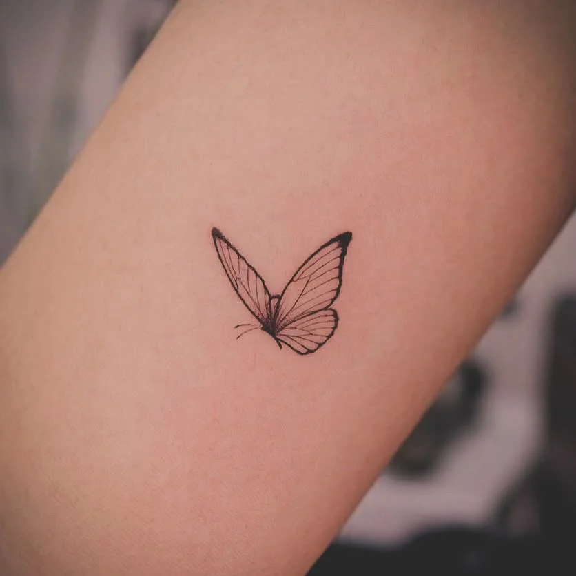 Minimal Butterfly Upper Arm Tattoos for Women
