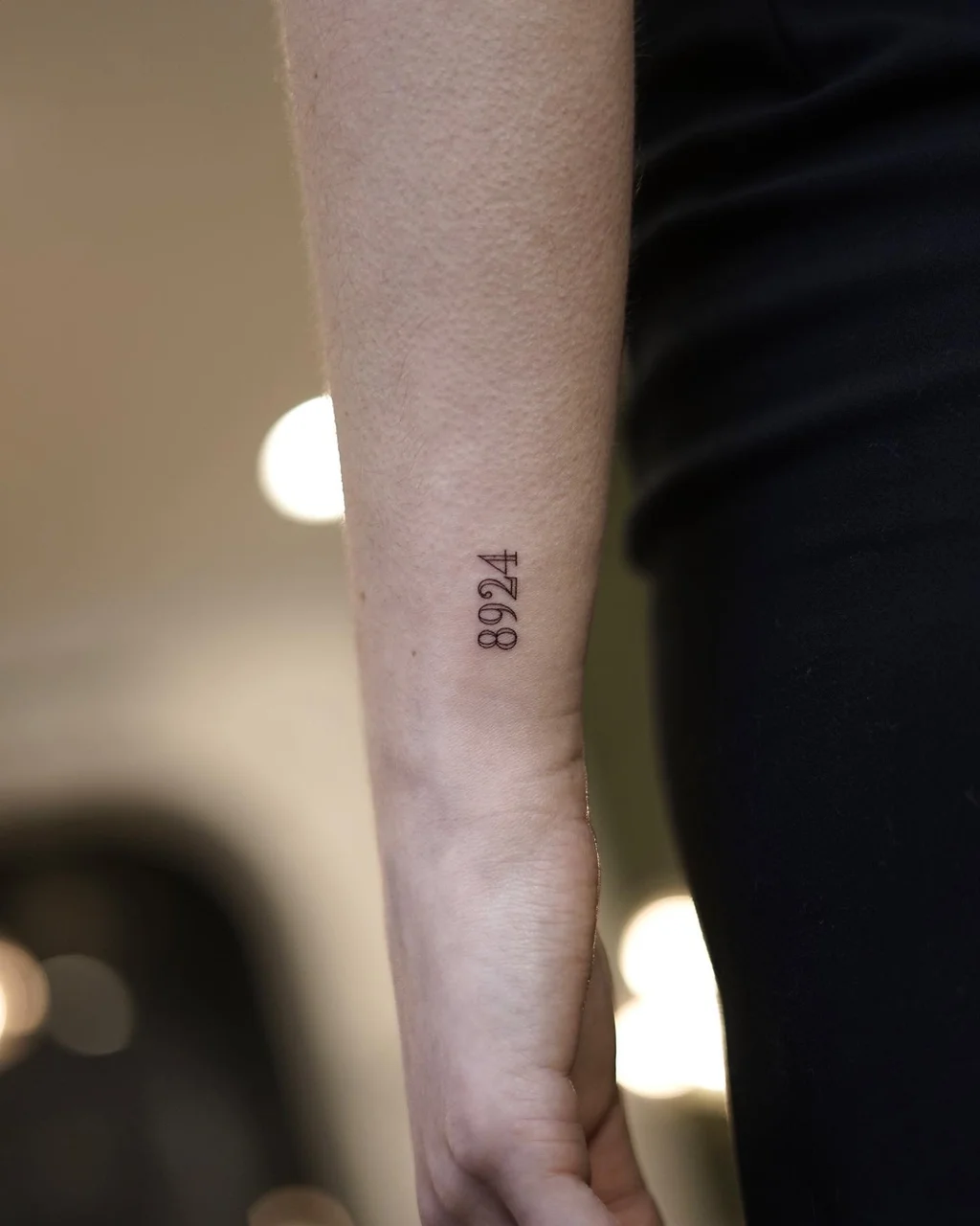 Wrist Tattoo with Vertical Numbers