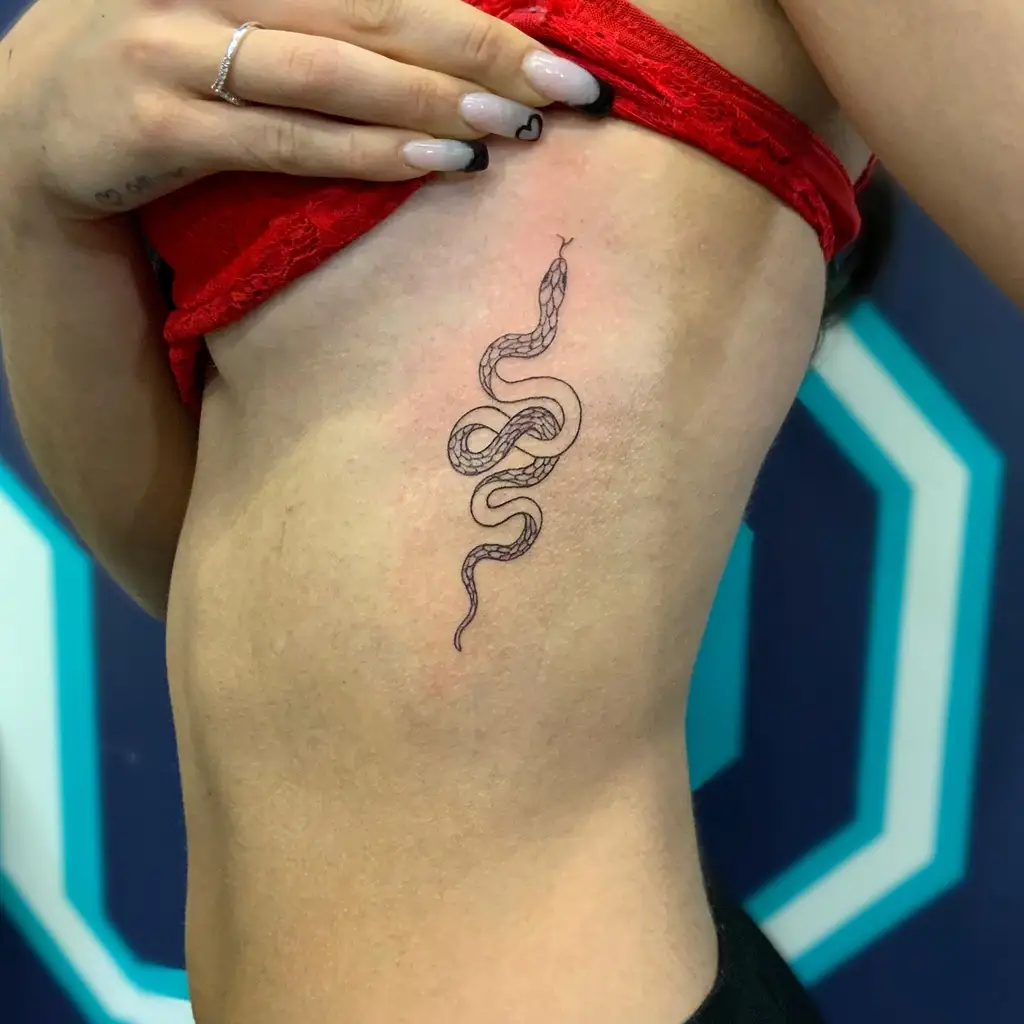 Minimal Snake Art Rib Tattoos for Women