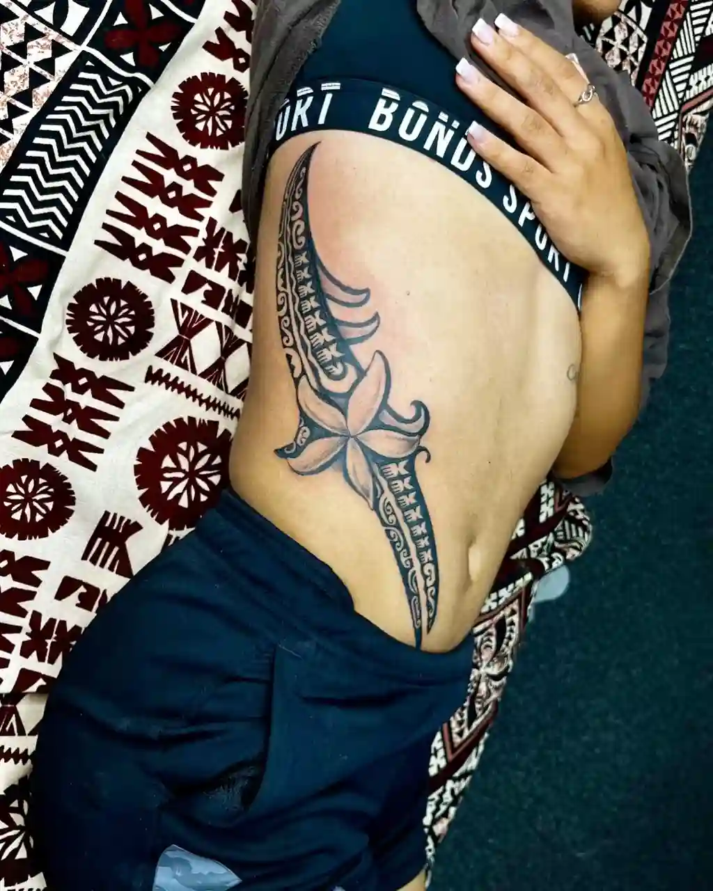 Polynesian Floral Rib Tattoos for Women