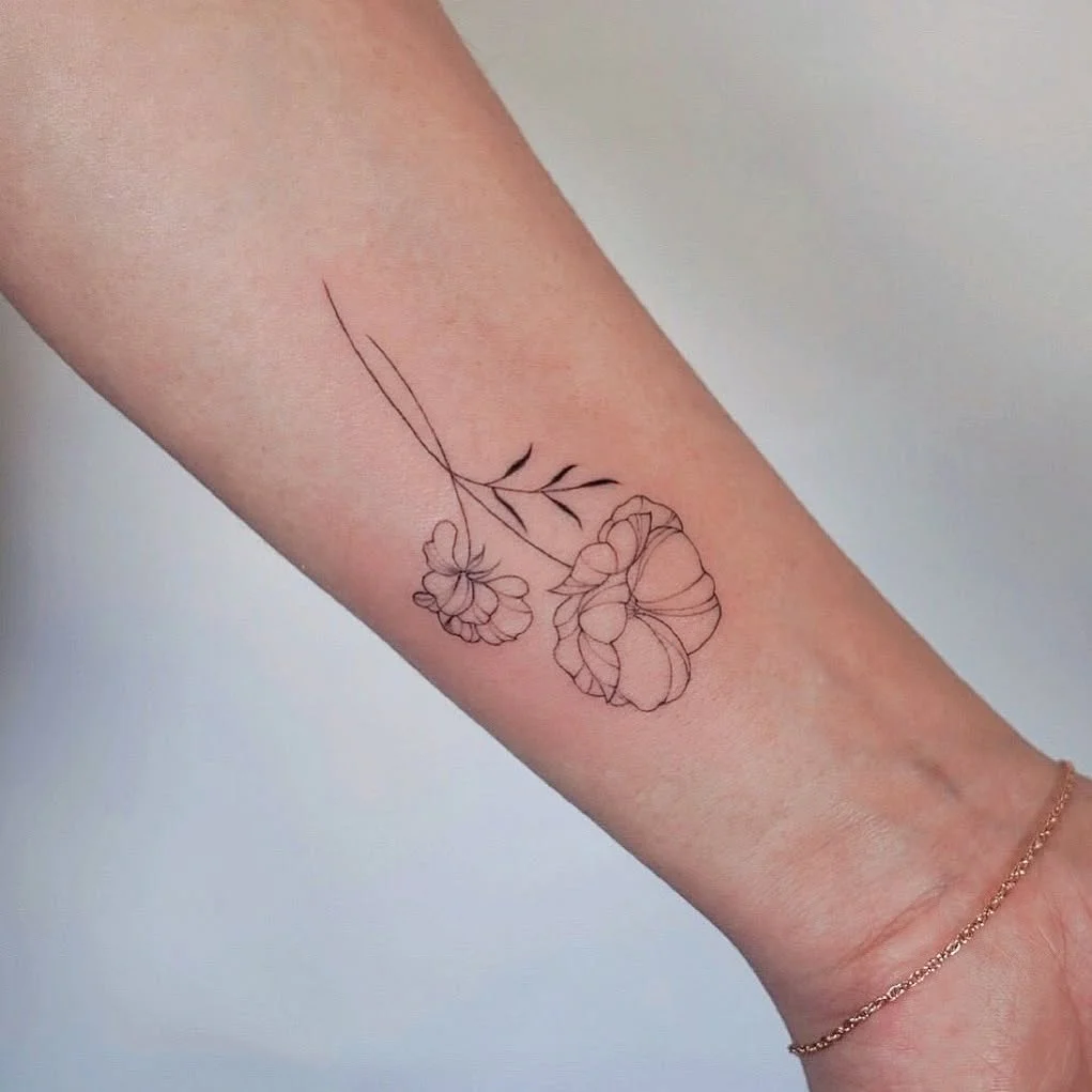 Delicate Floral Wrist Tattoo