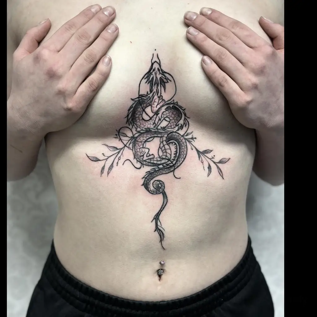 Chest Tattoo Female Serpent and Dagger Concept