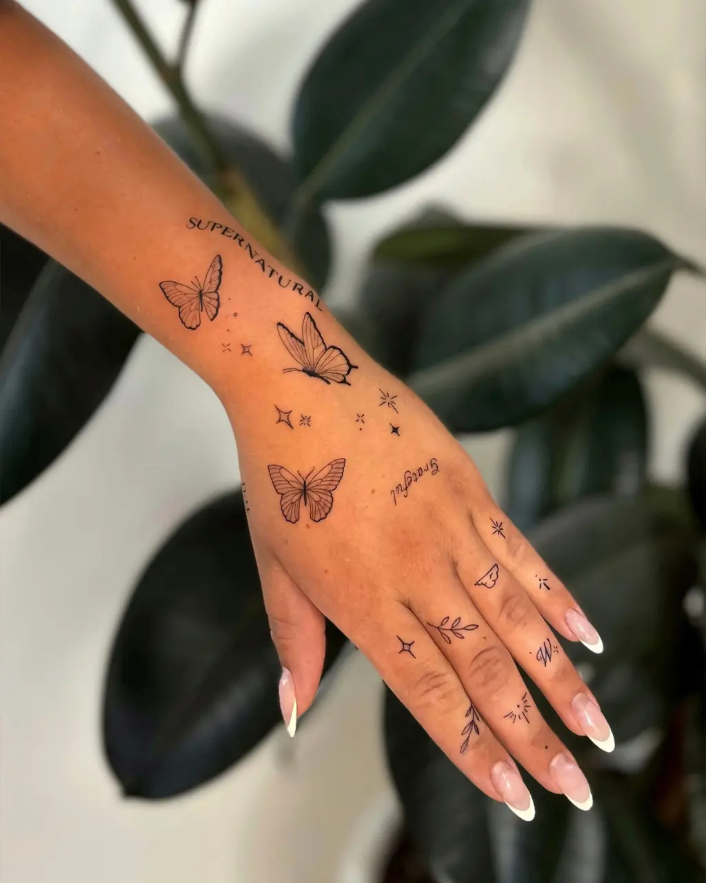 Script Butterfly Hand Tattoos for Women