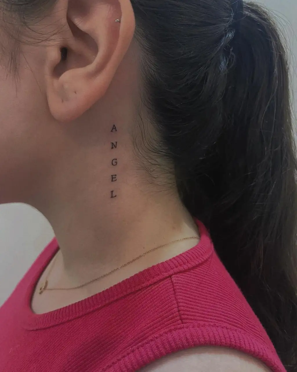 Vertical Word Neck Tattoo Women