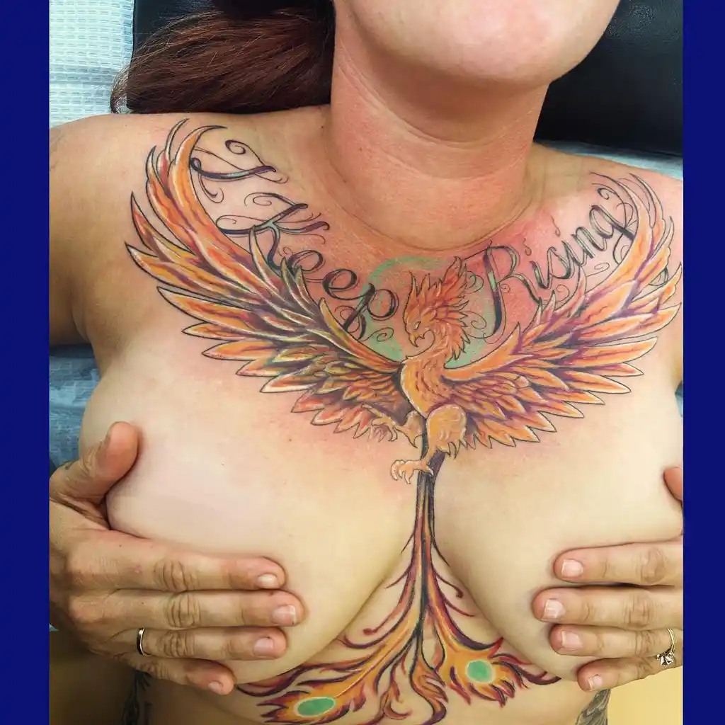 Chest Tattoo Female with Phoenix and “I Keep Rising” Quote