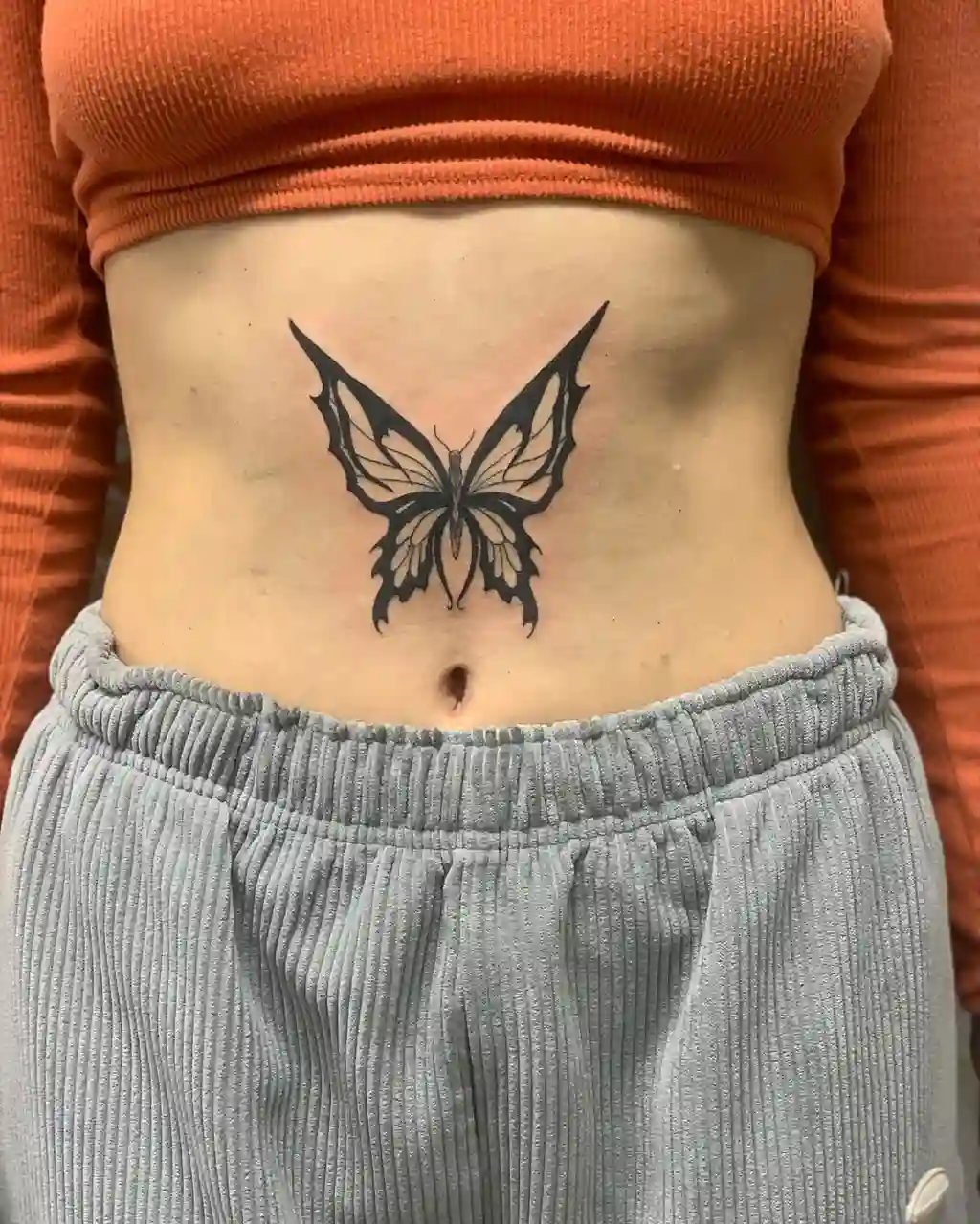 Bold Black Butterfly Stomach Tattoos Women