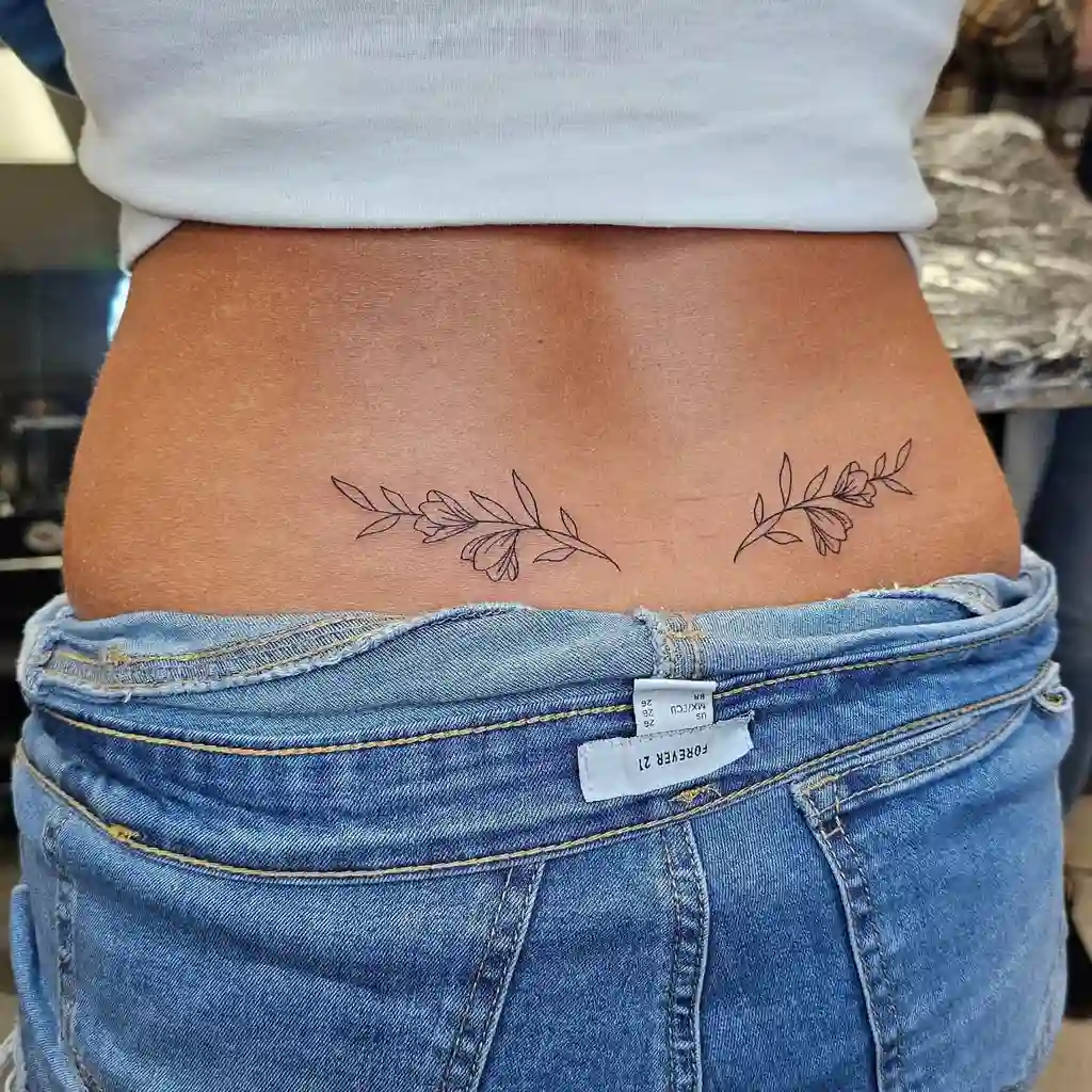 Minimalist Floral Lower Back Tattoo