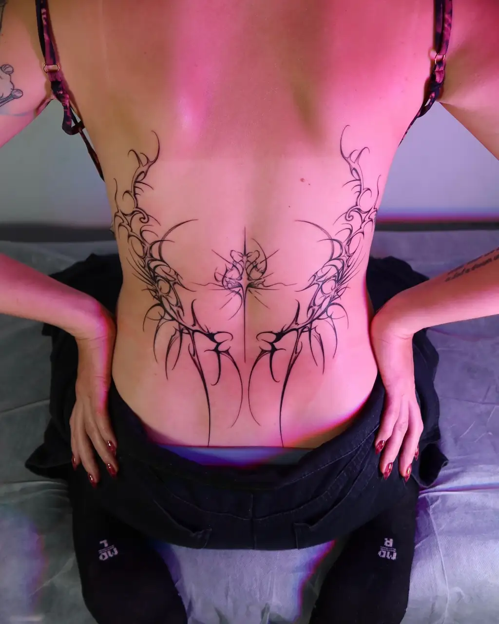 Intricate Floral Tribal Tattoo on Lower Back