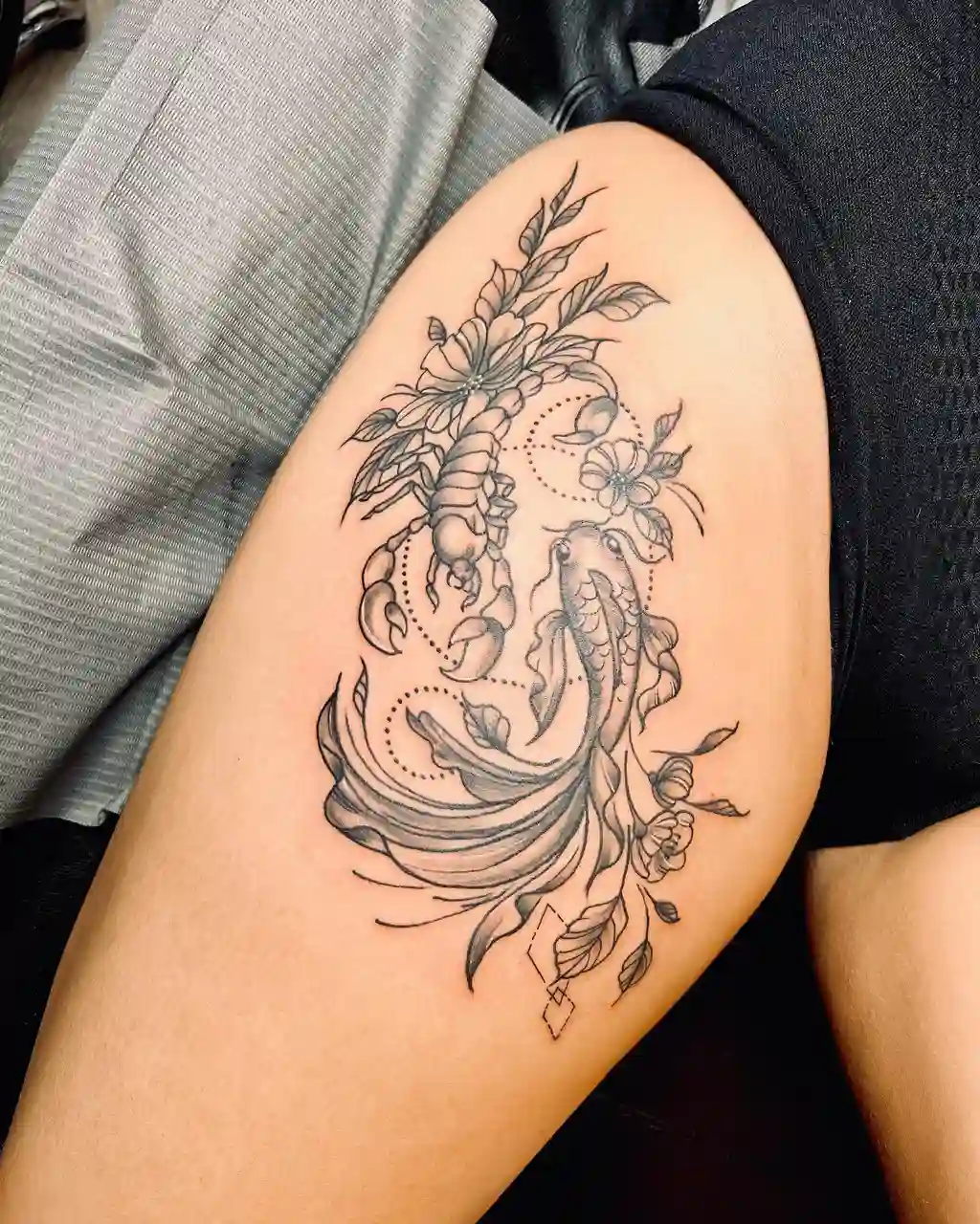 Koi and Scorpion Thigh Tattoos for Women
