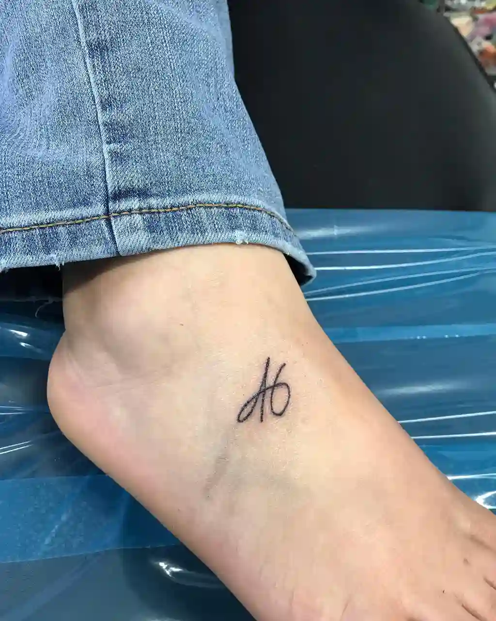 Initial Script Foot Tattoos for Women