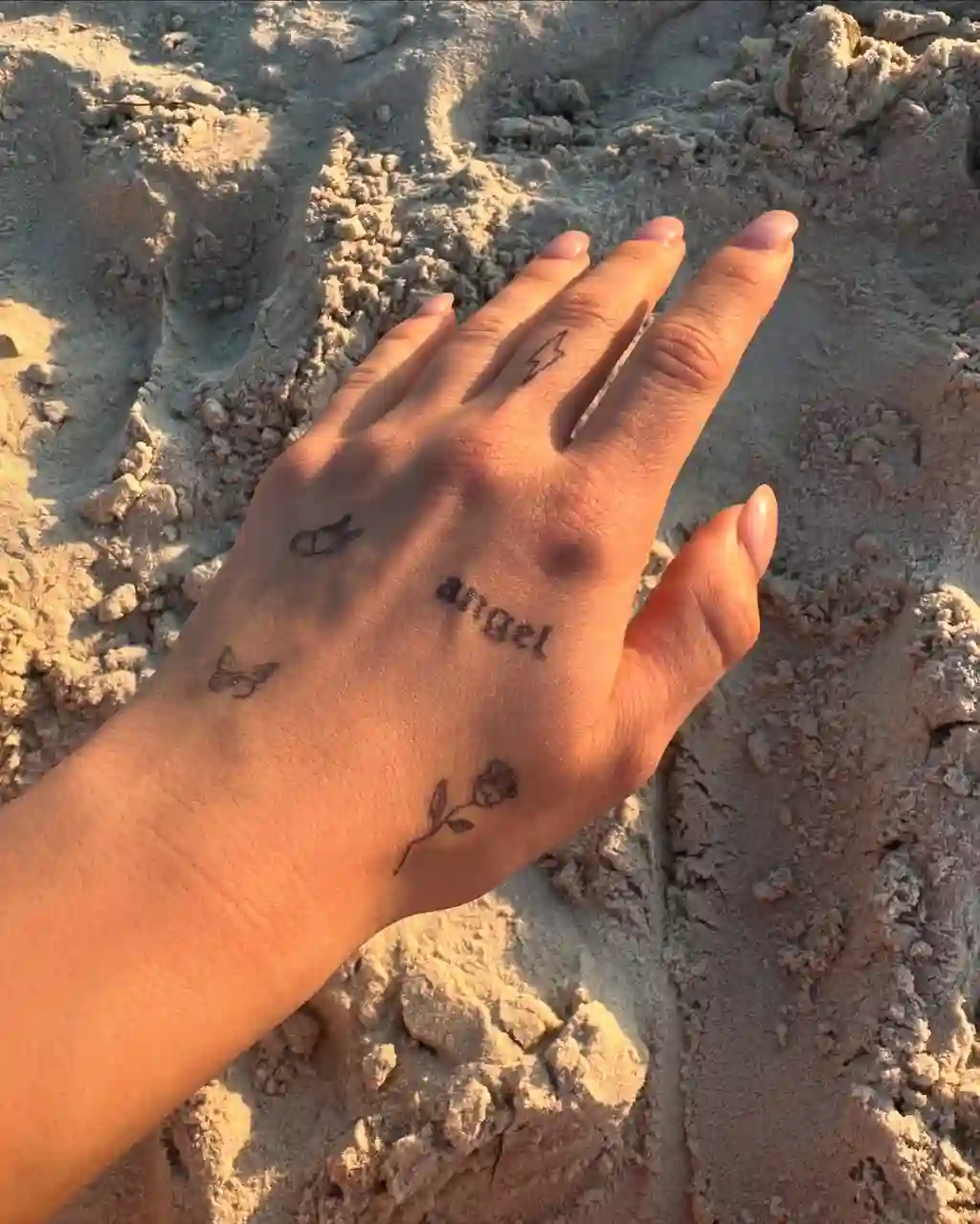 Tiny Symbols Hand Tattoos for Women