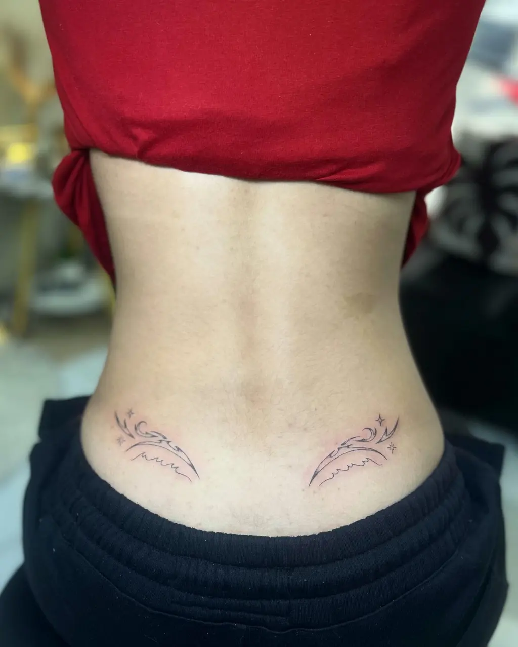 Minimal Star Wave Lower Back Tattoos for Women
