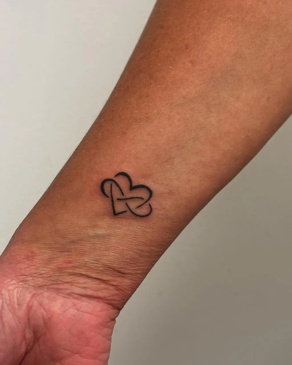 Interlocked Heart Wrist Tattoos for Women