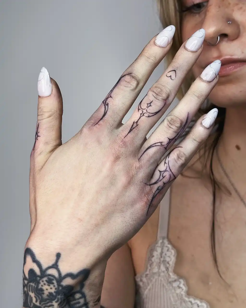 Ornamental Finger Tattoos for Women